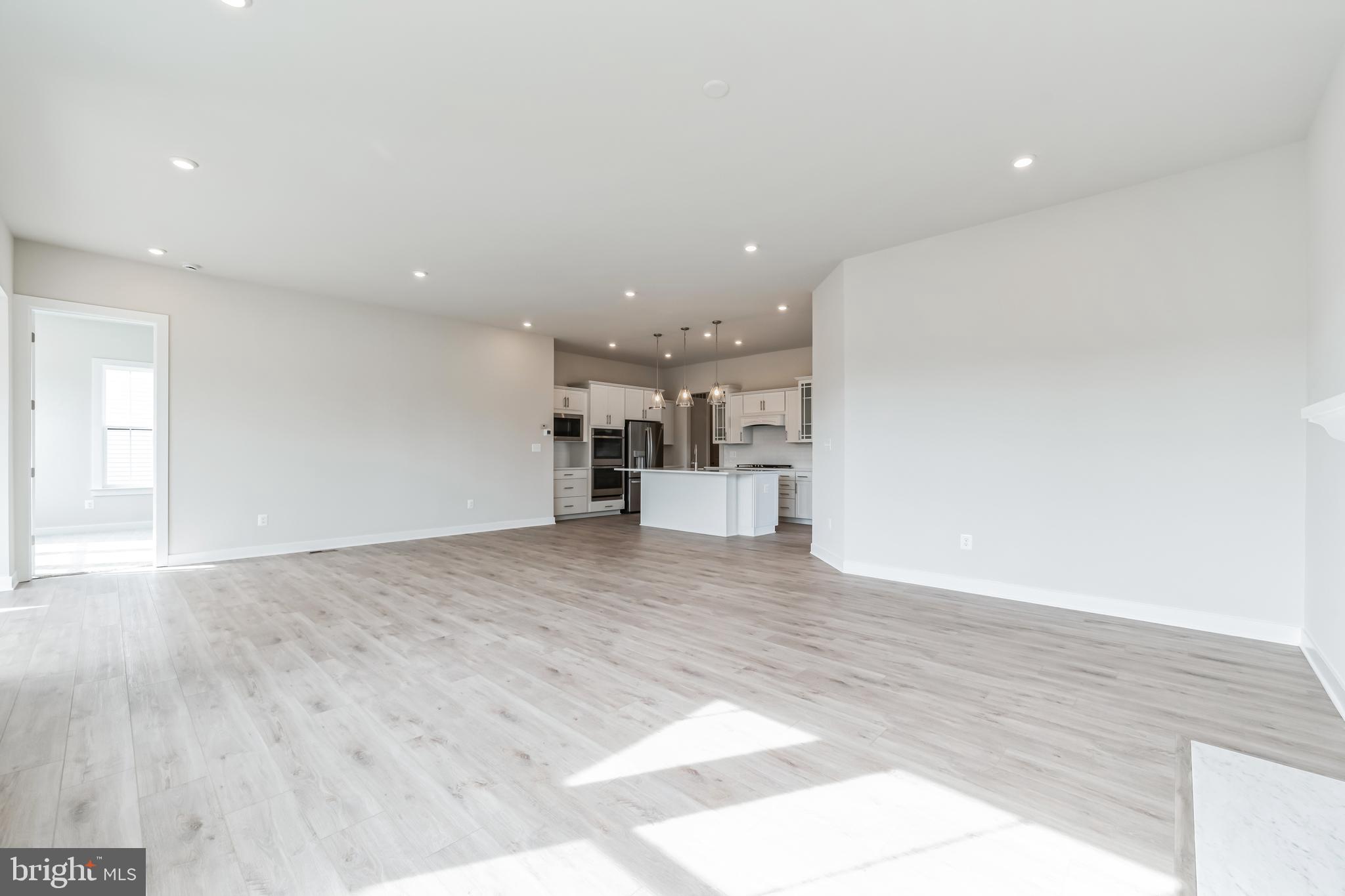 15513 Solomon Way Lewes, DE 19958 - Photo 8 of 20 a view of empty room with wooden floor
