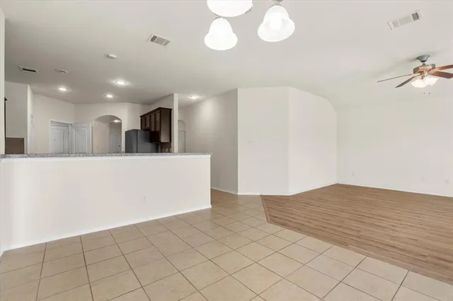 a view of a kitchen with a sink and cabinets