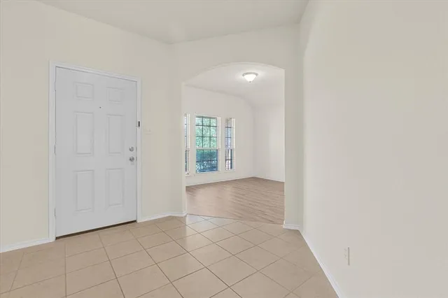 a view of an empty room and window
