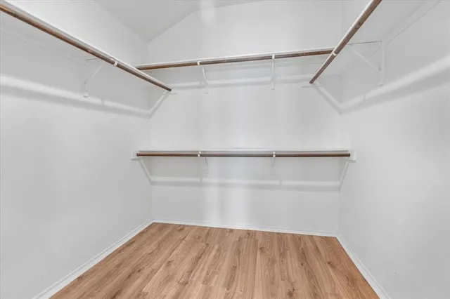 a bathroom with a granite countertop toilet and a shower