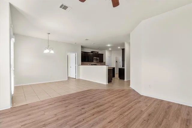 a view of a kitchen with a sink and a refrigerator