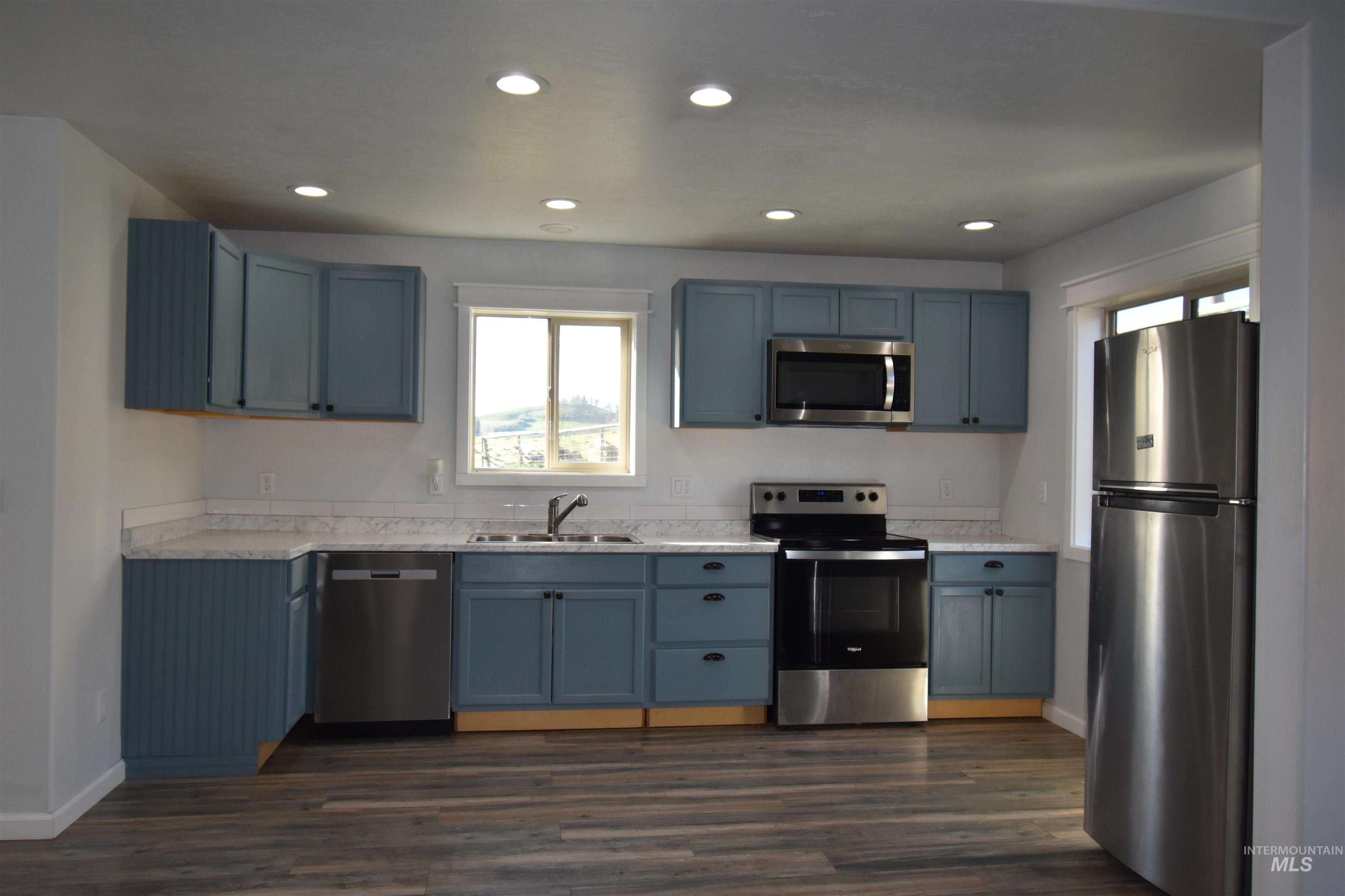 2599 Fruitvale Glendale Road Council, ID 83612 - Photo 11 of 29 Kitchen featuring stainless steel appliances, recessed lighting, and dark wood finished floors