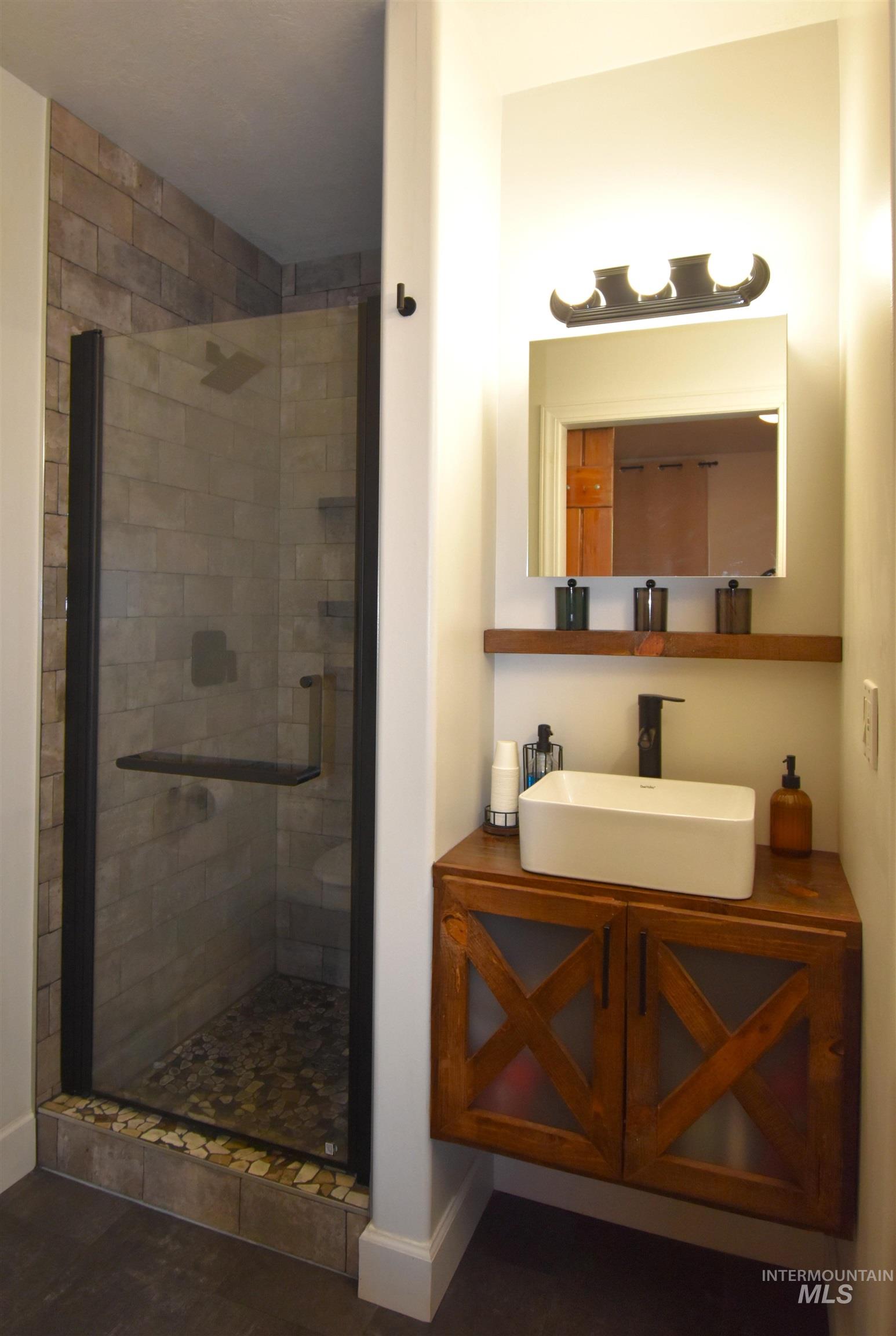 2599 Fruitvale Glendale Road Council, ID 83612 - Photo 12 of 38 Bathroom with vanity and a shower stall