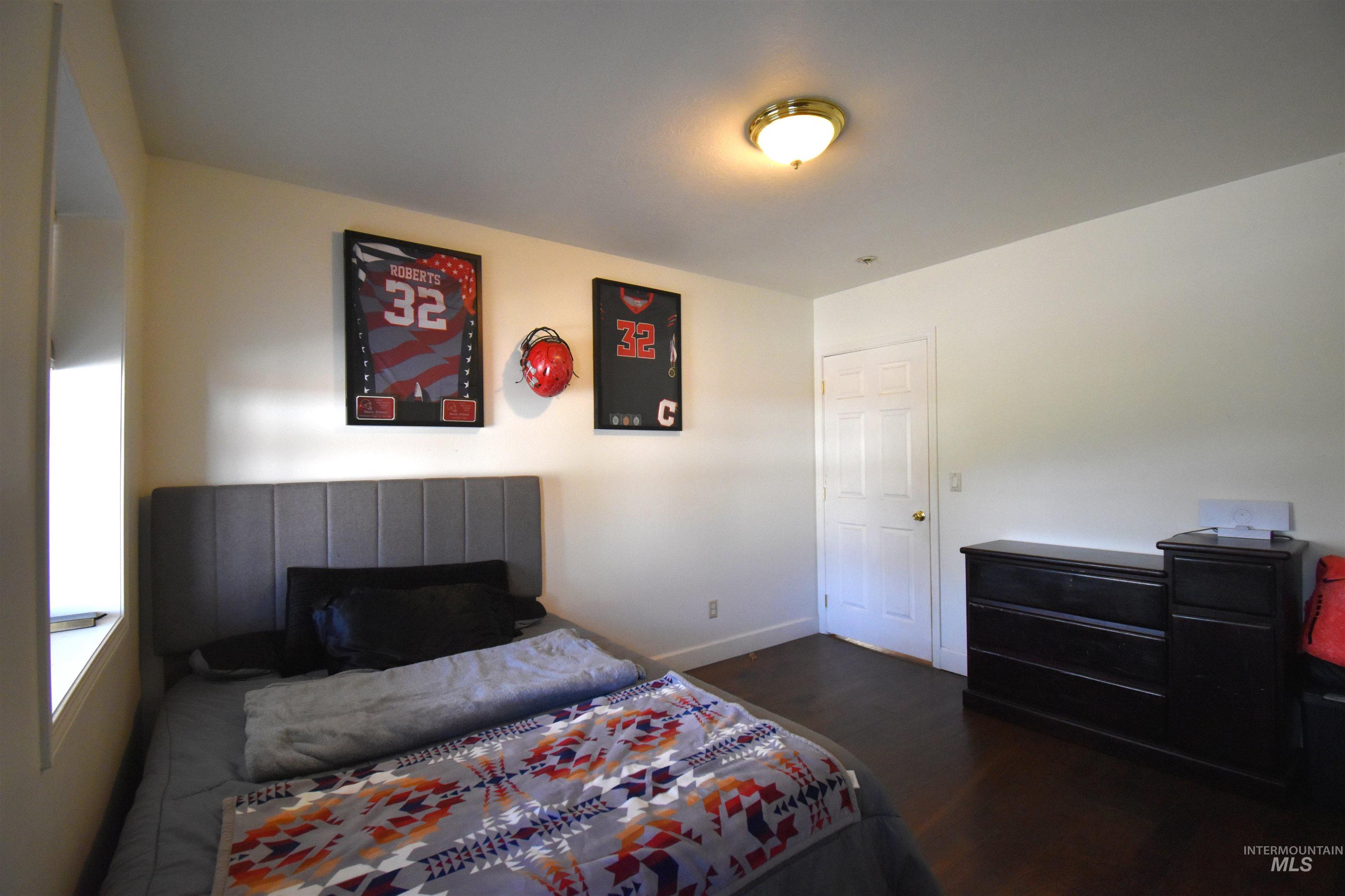 2599 Fruitvale Glendale Road Council, ID 83612 - Photo 17 of 38 Bedroom featuring dark wood-type flooring and a closet.