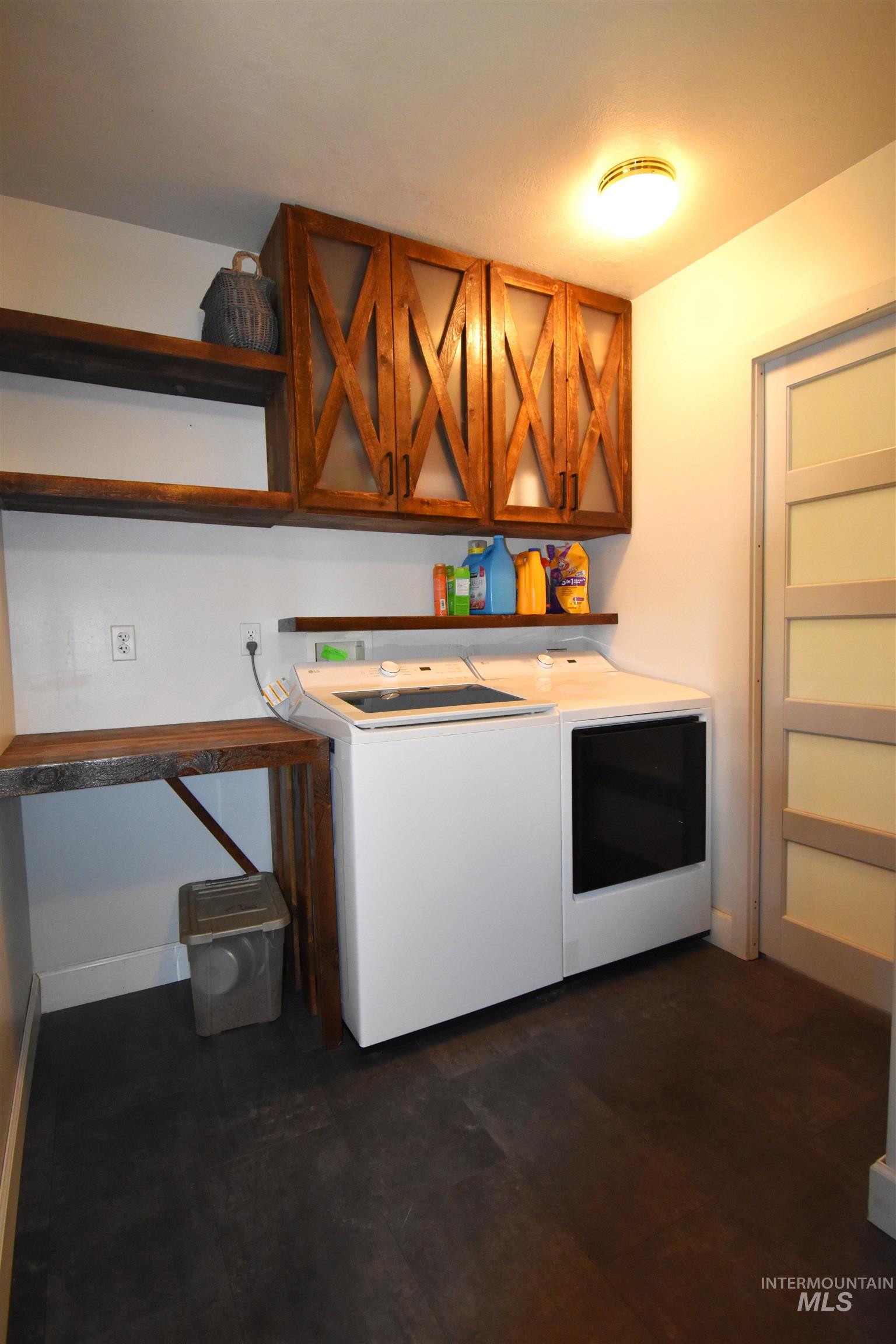 2599 Fruitvale Glendale Road Council, ID 83612 - Photo 26 of 29 Laundry room featuring washer / clothes dryer and dark wood-type flooring
