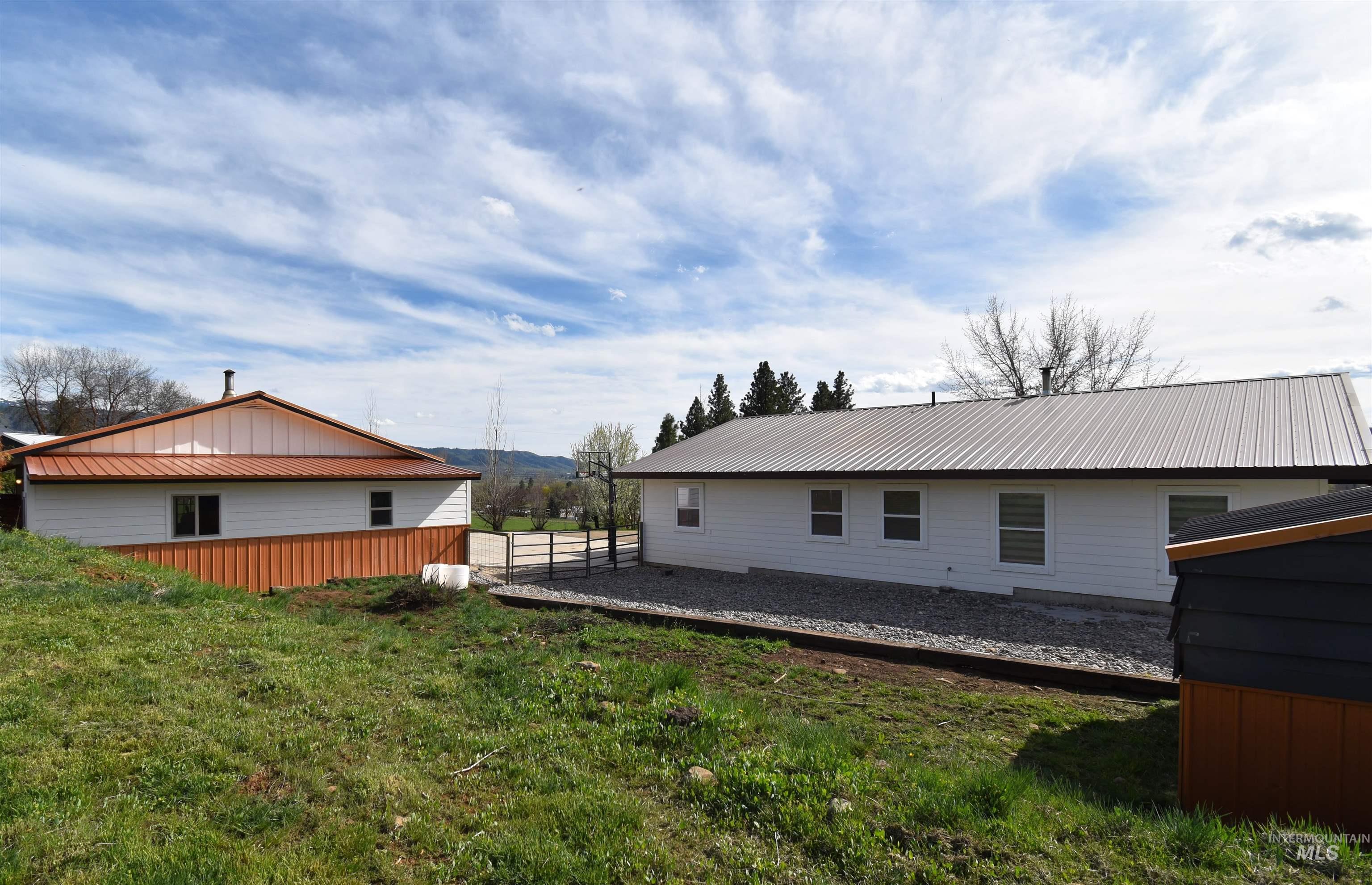 2599 Fruitvale Glendale Road Council, ID 83612 - Photo 7 of 29 View of property exterior featuring a metal roof
