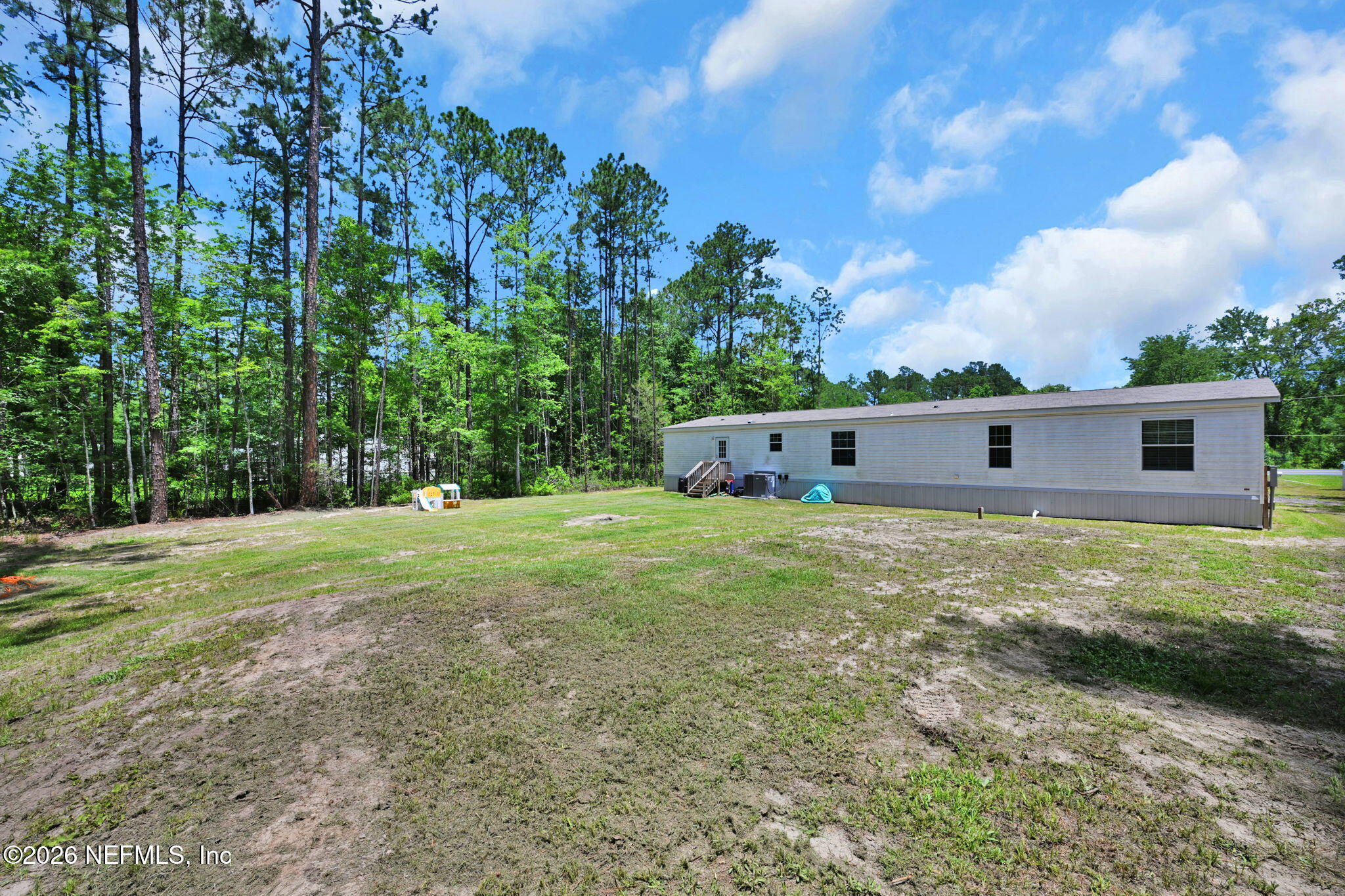 540783 Lem Turner Road Callahan, FL 32011 - Photo 35 of 36 a front view of a house with a yard