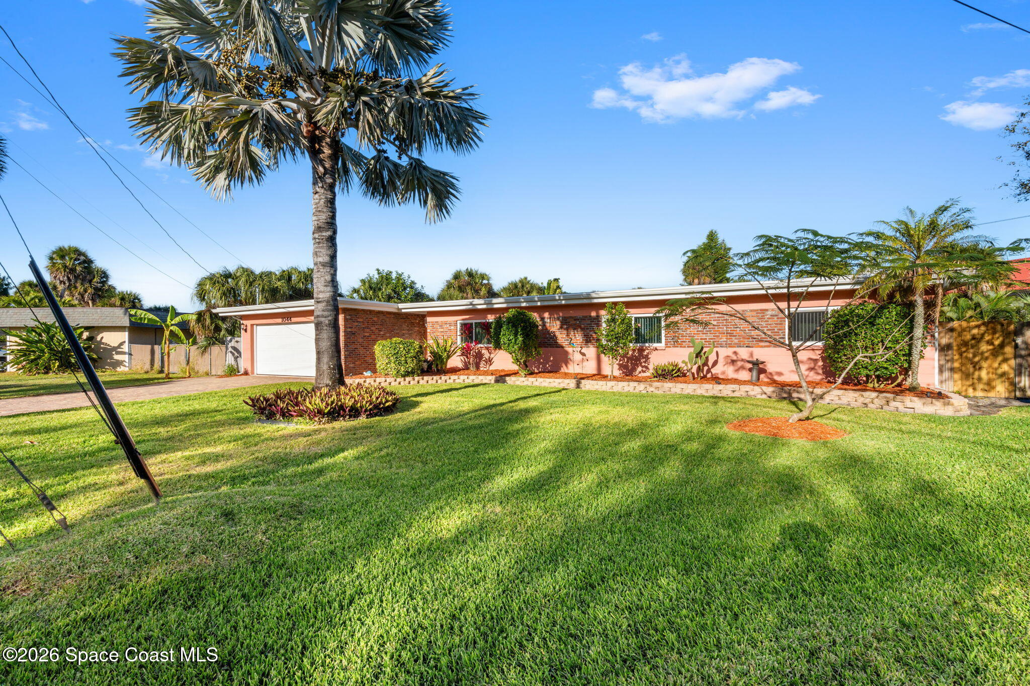 1044 Samar Road Cocoa Beach, FL 32931 - Photo 21 of 56 a view of swimming pool with a table and chairs