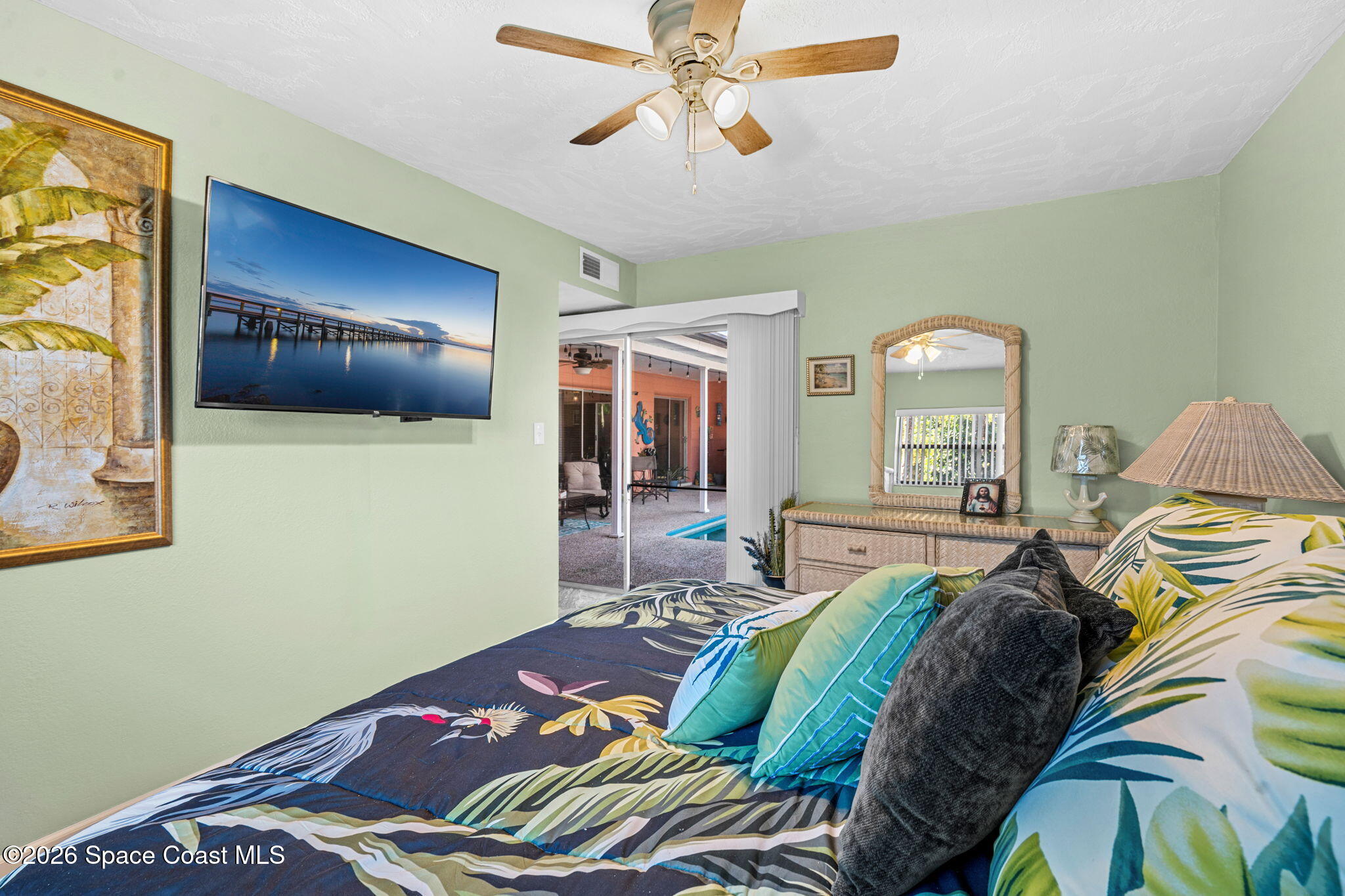 1044 Samar Road Cocoa Beach, FL 32931 - Photo 26 of 56 a bedroom with a bed and window