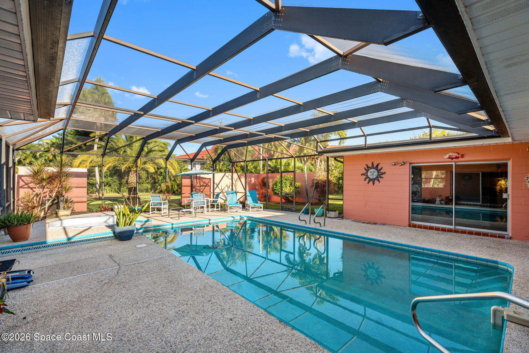 1044 Samar Road Cocoa Beach, FL 32931 - Photo 39 of 56 a view of a porch with furniture