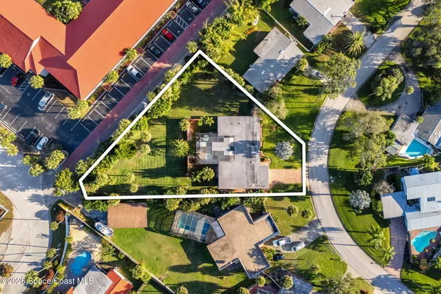 a living room with furniture and a lamp
