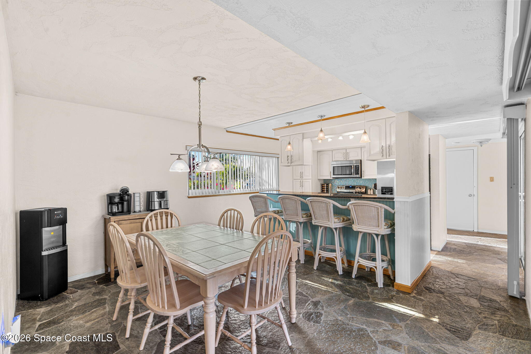 1044 Samar Road Cocoa Beach, FL 32931 - Photo 48 of 56 a view of a dining room with furniture window and outside view