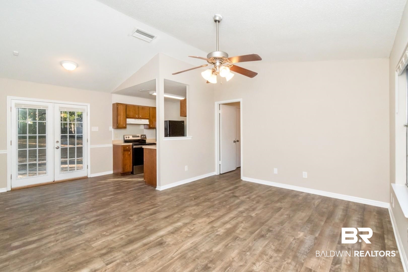 790 Hale Road Mobile, AL 36608 - Photo 2 of 23 Unfurnished living room featuring dark wood-style floors, french doors, and a ceiling fan