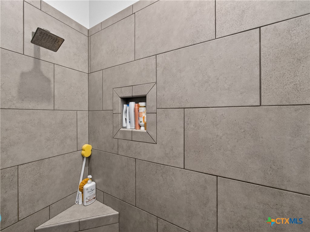 494 Flash Circle Luling, TX 78648 - Photo 21 of 44 a bathroom with a shower