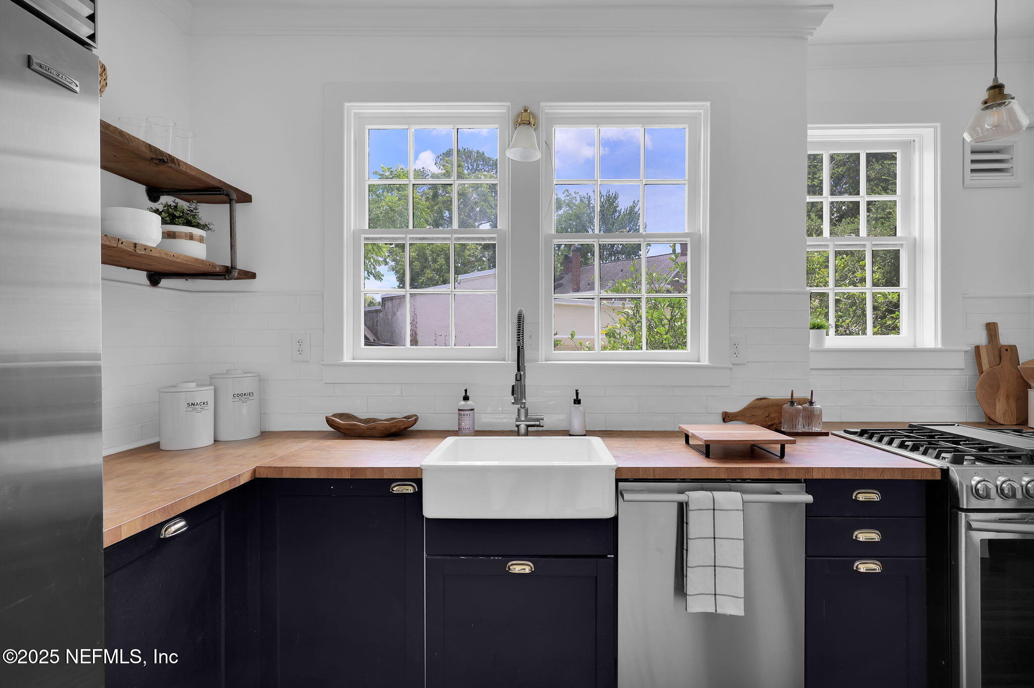 1475 Edgewood Circle Jacksonville, FL 32205 - Photo 16 of 60 a kitchen with a sink and a window