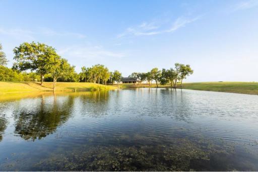 4251 Refuge Road Sherman, TX 75092 - Photo 33 of 40 a view of a lake with a yard