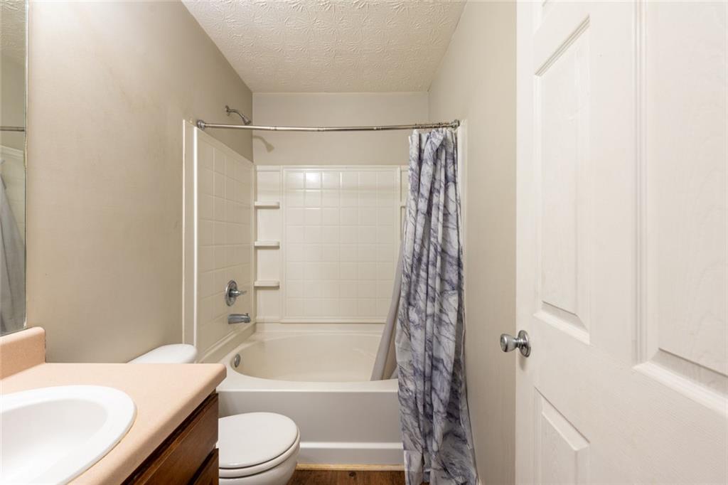 3474 Waldrop Trail Decatur, GA 30034 - Photo 17 of 17 a bathroom with a bathtub shower sink vanity and toilet