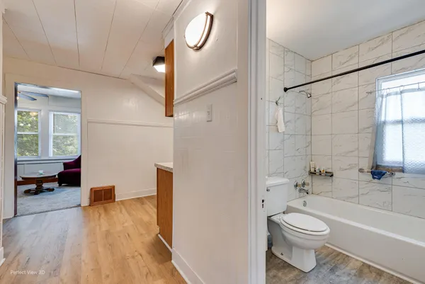 a bathroom with a toilet a sink and a shower