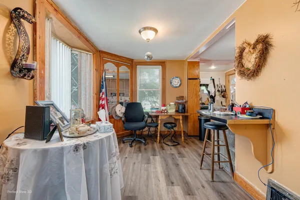 a view of a dining room with furniture window and outside view