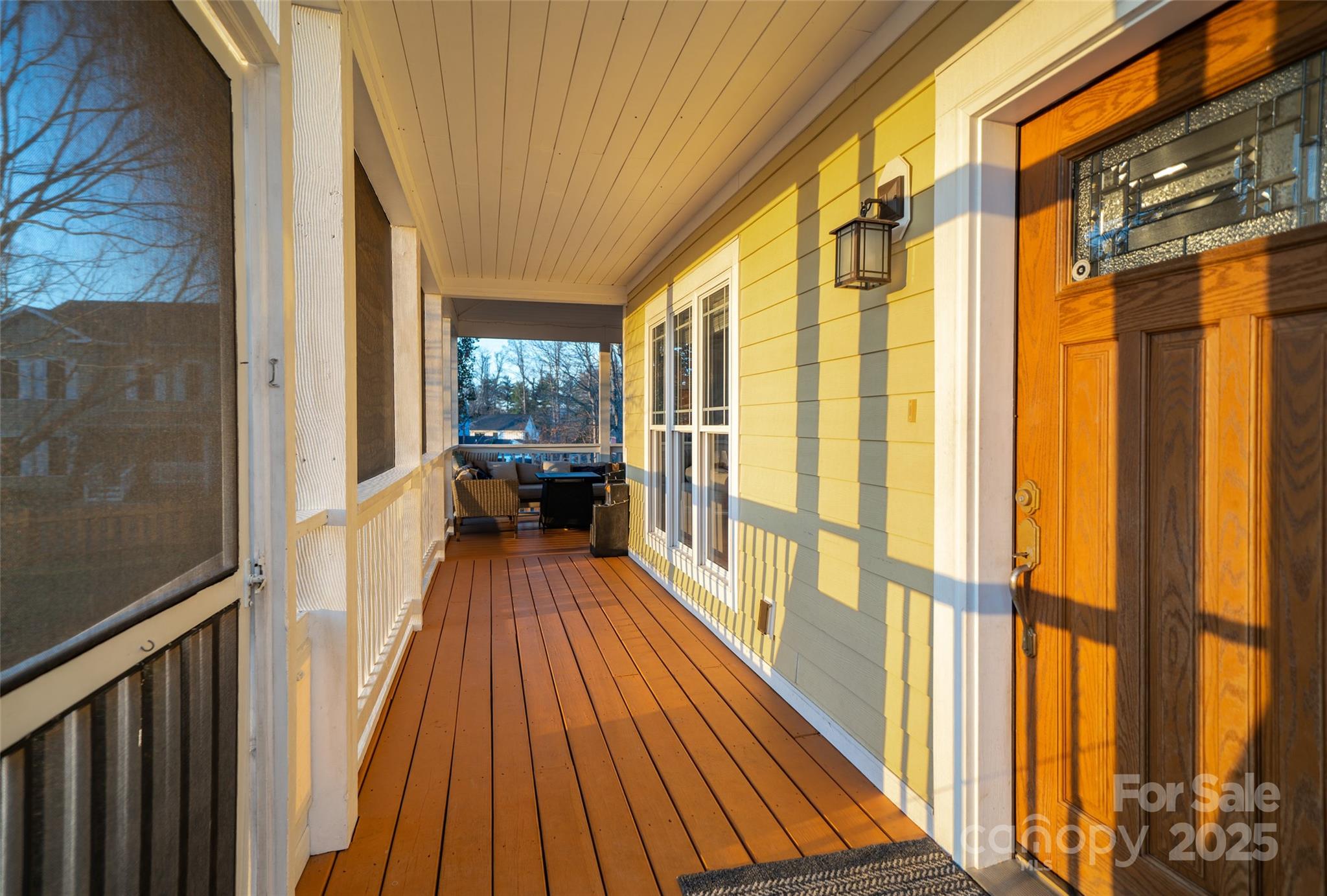11 Forest Park Lane Asheville, NC 28803 - Photo 18 of 26 a view of a balcony with wooden floor and furniture