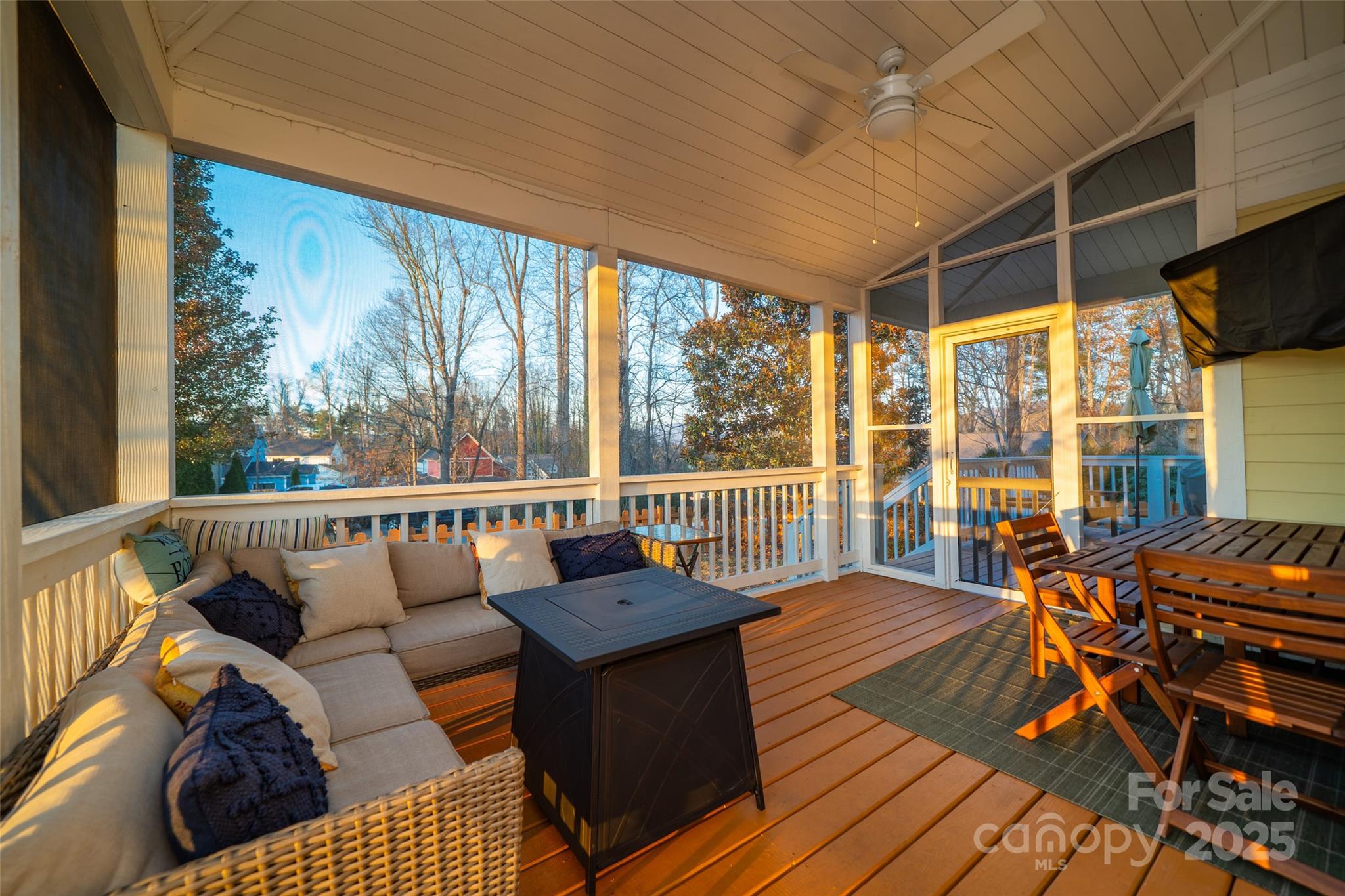 11 Forest Park Lane Asheville, NC 28803 - Photo 19 of 26 a balcony with wooden floor and outdoor seating
