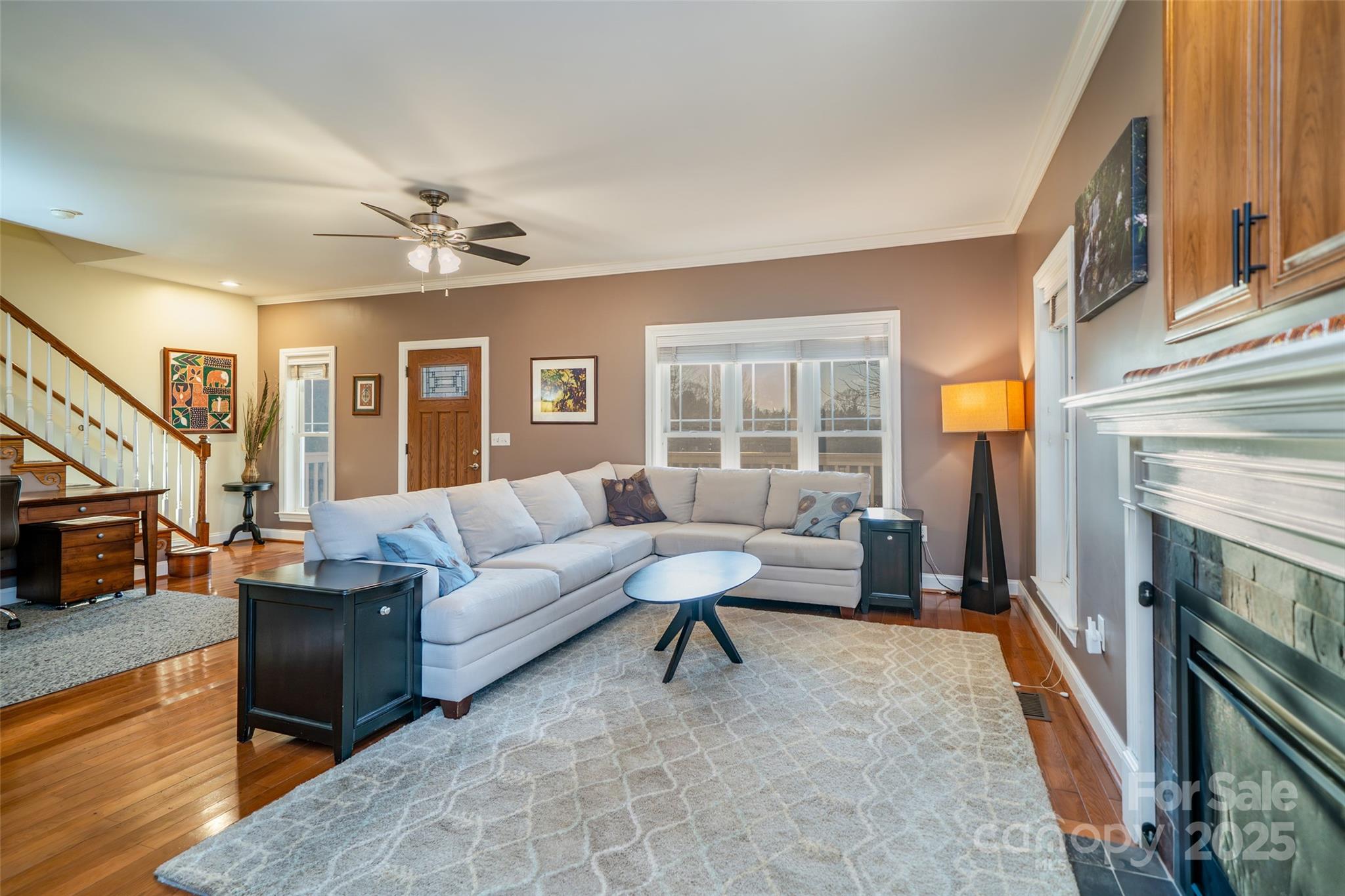 11 Forest Park Lane Asheville, NC 28803 - Photo 5 of 26 a living room with furniture and a fireplace