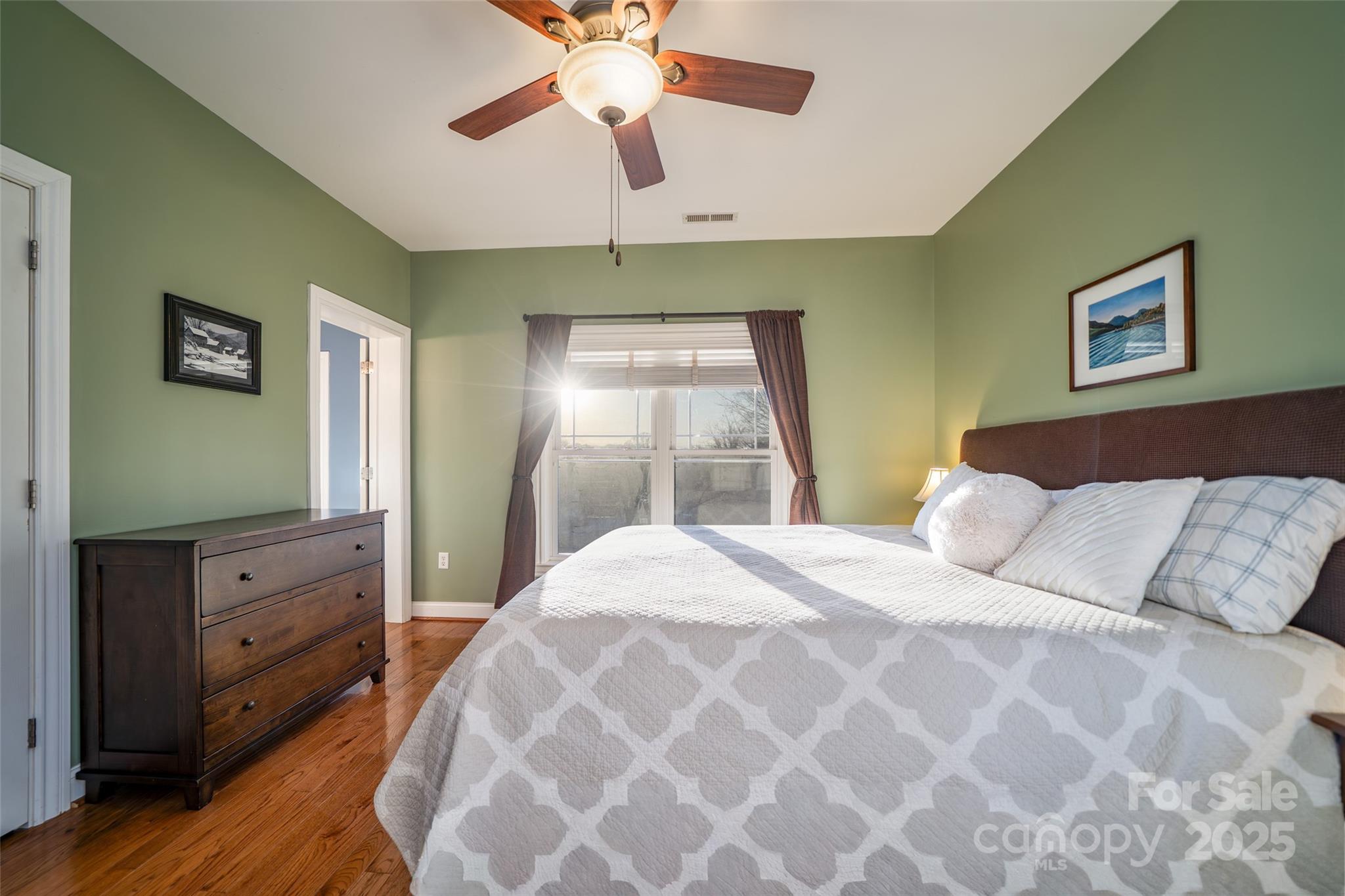 11 Forest Park Lane Asheville, NC 28803 - Photo 10 of 26 a bedroom with a bed and a window
