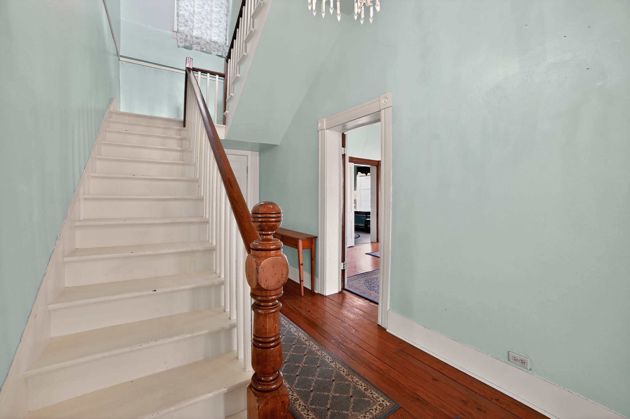 400 South Main Street Belton, TX 76513 - Photo 16 of 18 Stairway with hardwood / wood-style floors and baseboards