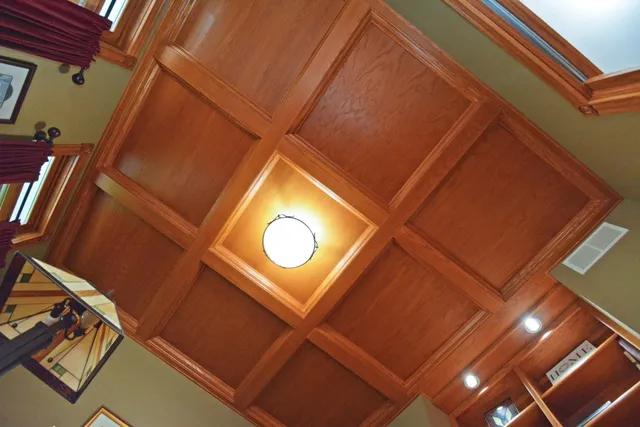 a living room with fireplace furniture and a chandelier