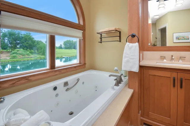 a view of a house with backyard and garden