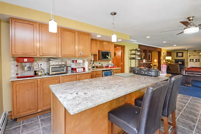 a view of a livingroom with wooden floor and a window