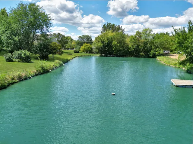 a living room with furniture a rug and a window