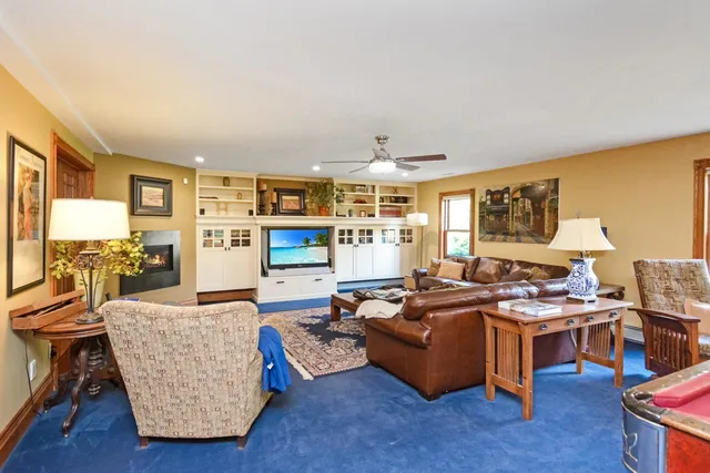 a large kitchen with granite countertop a sink and cabinets