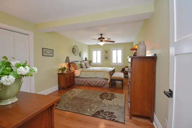 a bedroom with a bed and a lamp