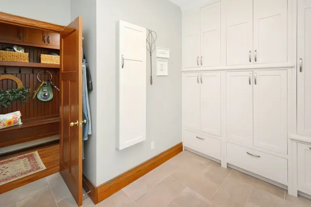 a view of a workspace with furniture and a ceiling fan