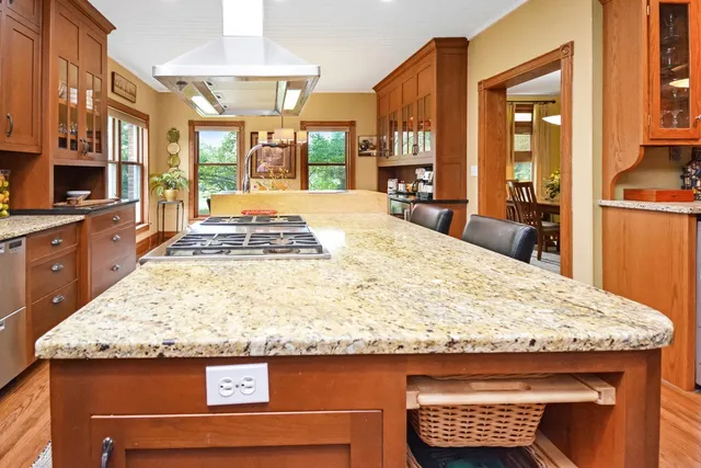 a dining room filled with lots of furniture and chandelier