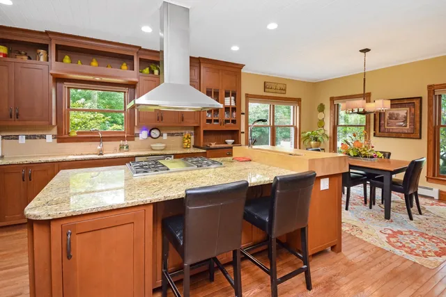 a living room with furniture a rug and a large window