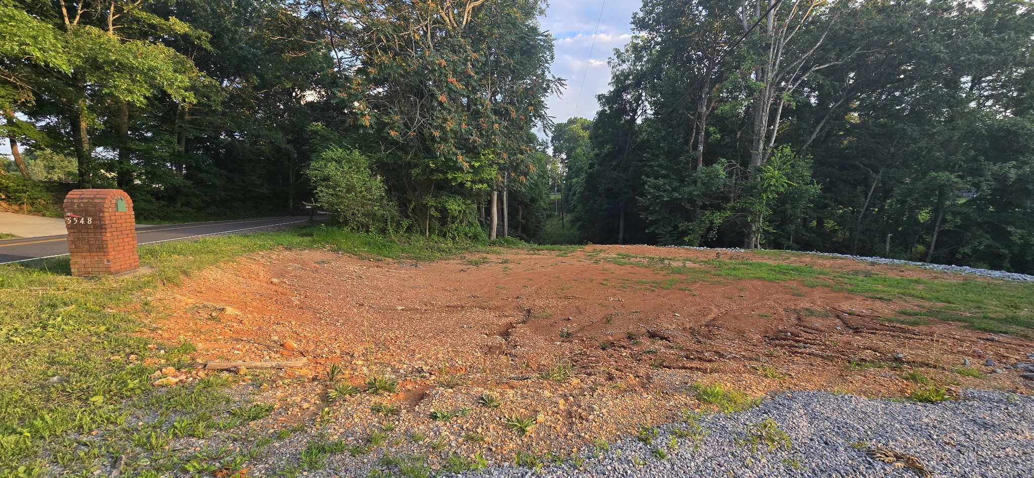 a backyard of a house with lots of green space