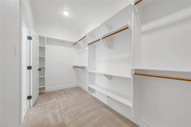 a view of an empty walk in closet