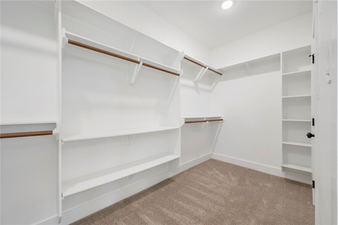 569 Harvest Lk Drive Snook, TX 77879 - Photo 15 of 22 Walk in closet with light carpet