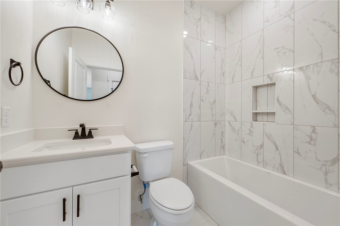 569 Harvest Lk Drive Snook, TX 77879 - Photo 18 of 22 Bathroom featuring vanity and shower combination