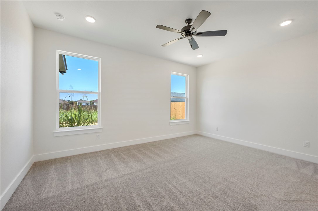 569 Harvest Lk Drive Snook, TX 77879 - Photo 8 of 22 Spare room with carpet, recessed lighting, and ceiling fan