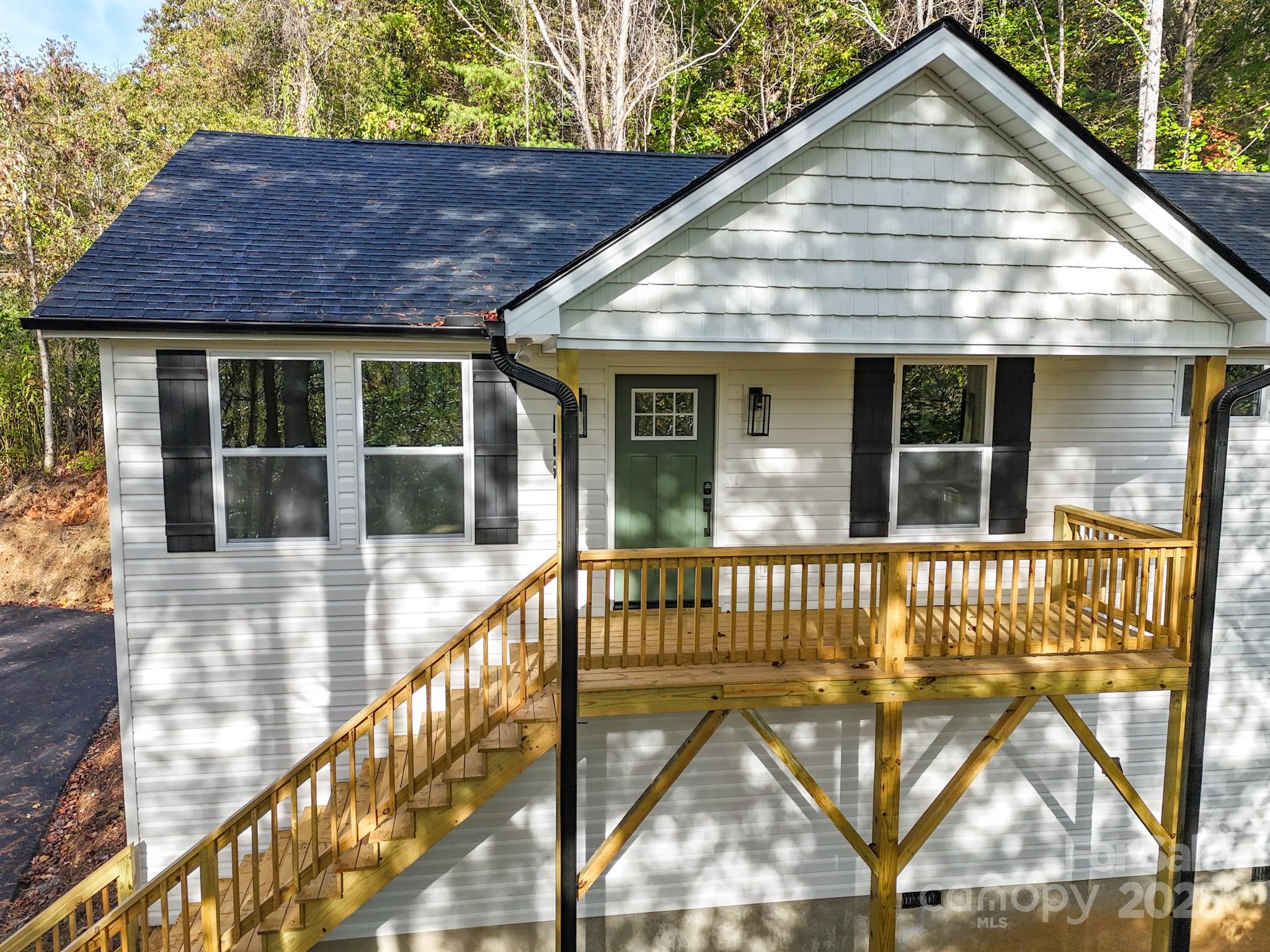 700 Old Fort Road Fairview, NC 28730 - Photo 7 of 42 a view of house with a yard and sitting area