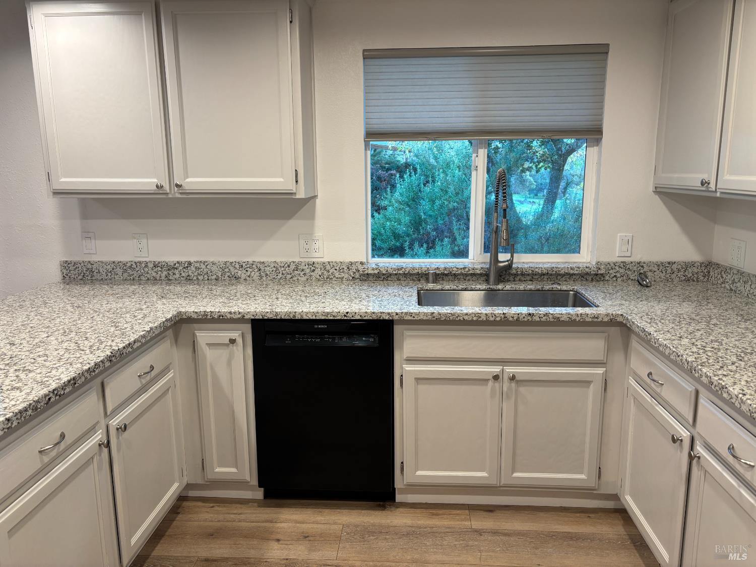 1776 Meda Avenue Santa Rosa, CA 95404 - Photo 11 of 28 a kitchen with granite countertop stainless steel appliances white cabinets and a window