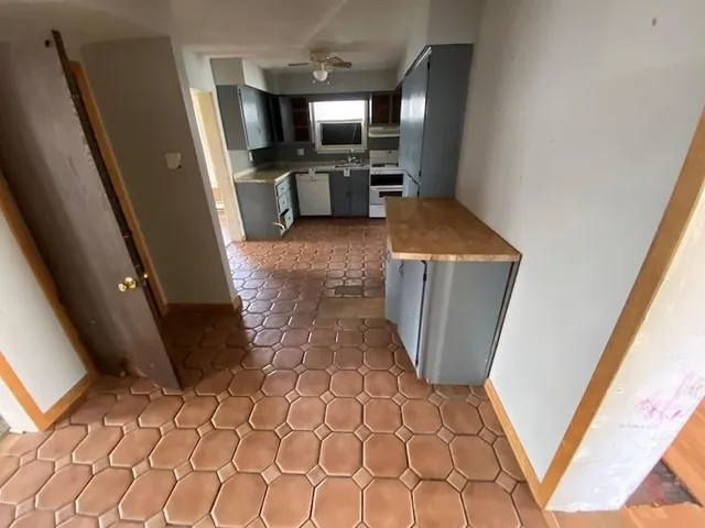 a view of entryway with window and wooden floor