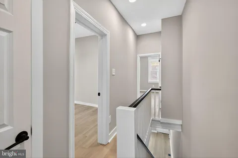 a view of entryway with wooden floor