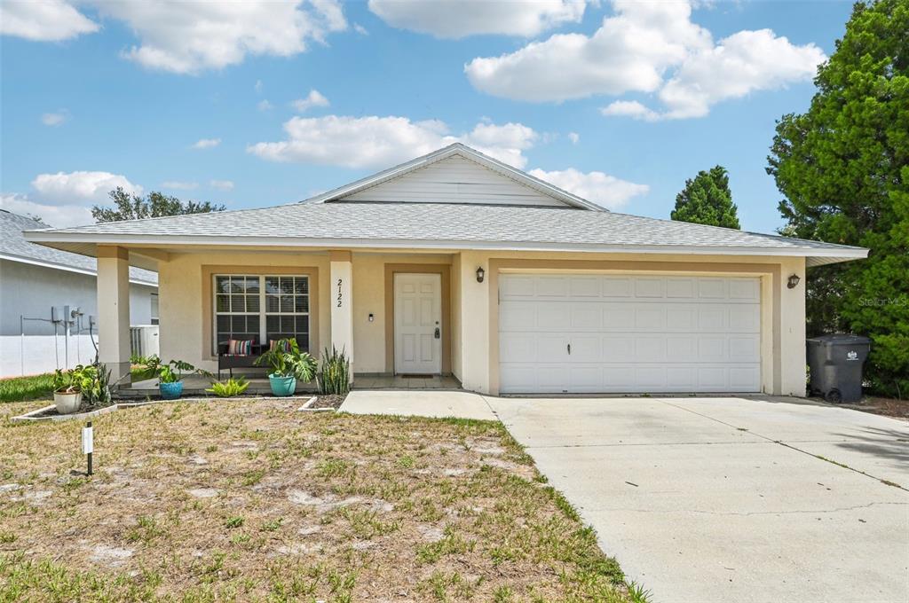 2122 Pleasure Run Drive Ruskin, FL 33570 - Photo 1 of 1 a front view of a house with garden