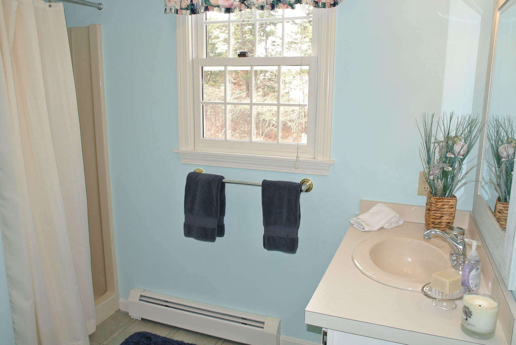 32 Wintergreen Road Mashpee, MA 02649 - Photo 8 of 19 a bathroom with a sink a toilet and mirror