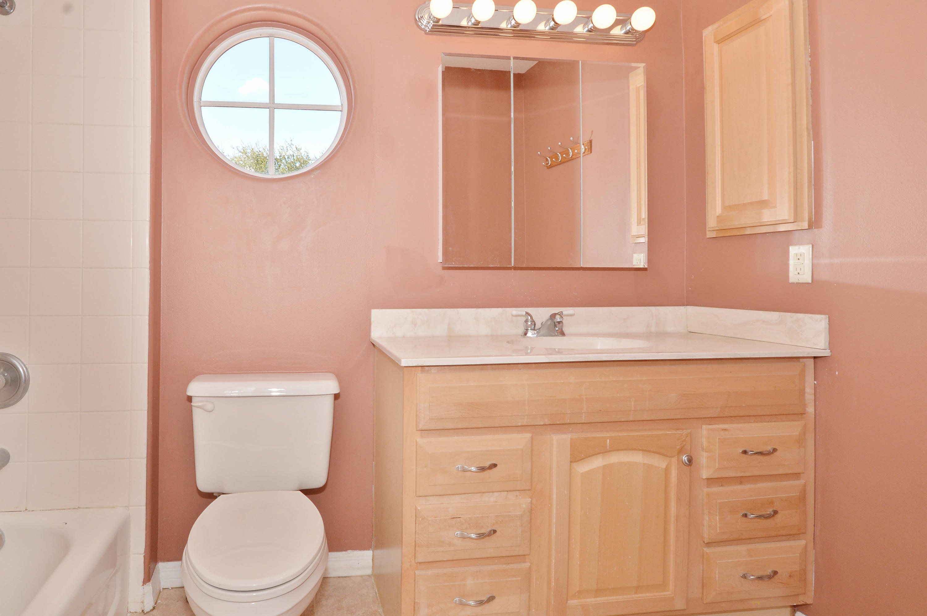 1132 Canoe Point Delray Beach, FL 33444 - Photo 11 of 16 a bathroom with a toilet a sink and a mirror