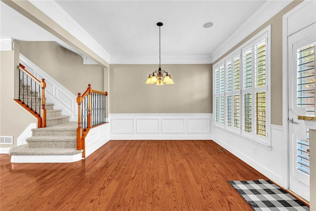 4888 Colchester Court, Unit 163 Atlanta, GA 30339 - Photo 15 of 44 a view of empty room with wooden floor and fan